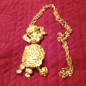 Rare vintage large statement piece. Gold plated poodle pendant on chain.